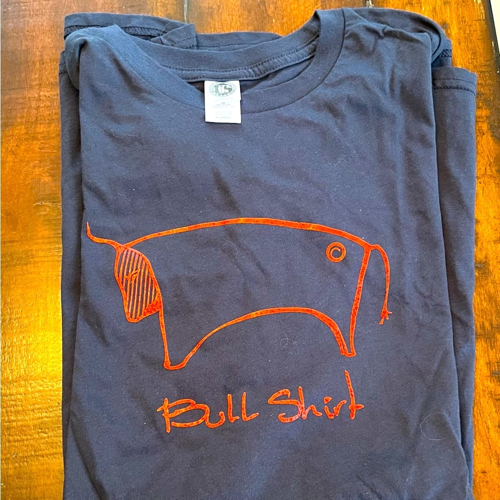 2 Tshirts. Men’s Navy blue “Bull Shirt” ;) and Grey women’s size medium